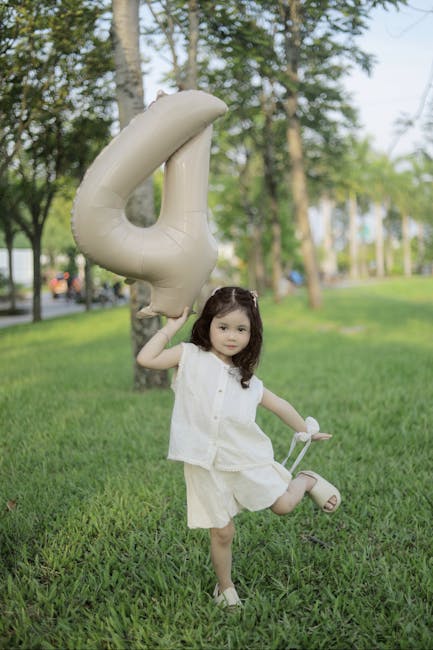 Child holding 4 balloon representing future generational support